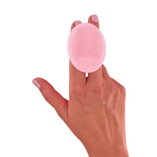 Pink silicone Scrubby Doo Dah facial cleansing and exfoliating pad on hand