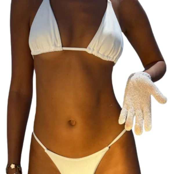 White exfoliating glove for tan prep and smooth skin shown on model wearing white bikini