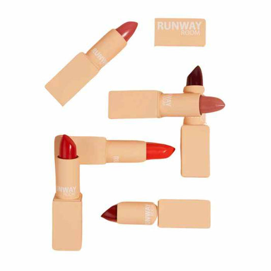 Collection of Runway Room lipsticks in various shades with beige packaging, featuring bold colors and creamy texture for long-lasting wear.