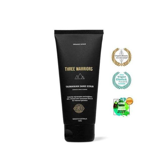 Three Warriors Tasmanian Sand Scrub tube with exfoliation and hydration claims, featuring award badges.